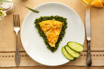 Healthy vegetarian breakfast with omelet made with vegetables and eggs, fresh orange juice. Fast cooking lunch with organic ingredients.