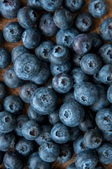 Fresh blackberries over a wooden rustic board