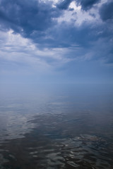 Stormy sky over calm sea