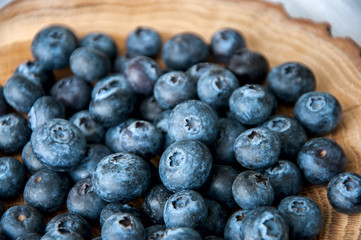 Fresh blackberries over a wooden rustic board