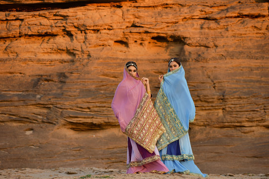 Young traditional Indian woman portrait on desert background,vintage style