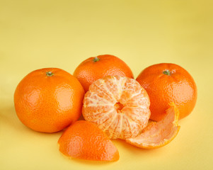 Ripe mandarin close-up on a white background. Tangerine orange. Colorful Food and drink still life concept. Fresh fruits and vegetables on color background. Clementine. Citrus. Fresh fruits. Diet.