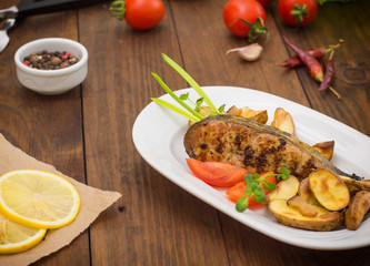 Deep Fried Dolly Fish Steak with French fries on wood background. Top view. Close-up