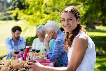 Fototapeta premium Portrait of beautiful woman having a glass of red wine