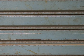 rusty old gray rolling steel door texture for background with copy space, seamless