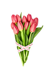 Bouquet of bright pink tulips decorated with ribbon isolated over white background. Valentines Day concept 