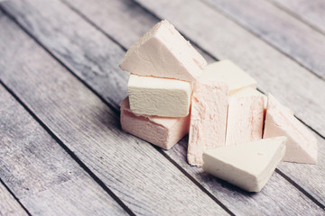 fresh marshmallows on a wooden background