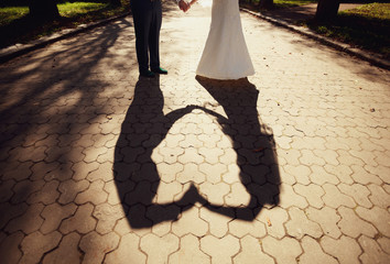 The lovely couple in love walking along the park