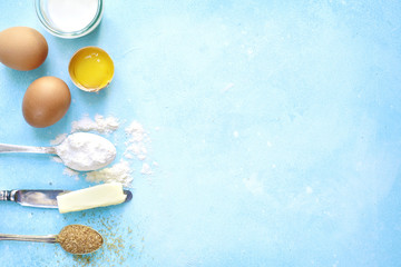 Ingredients for baking - eggs,flour,sugar,butter,milk.Top view w