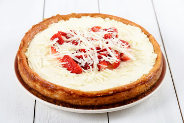 Homemade Strawberry Cheesecake On White Table