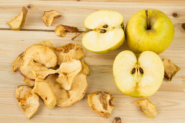 Naklejka na ściany i meble Dried and fresh apples on a wooden background