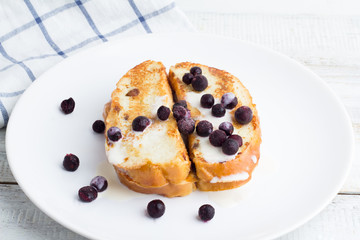 French toast with berries and yogurt for breakfast close up