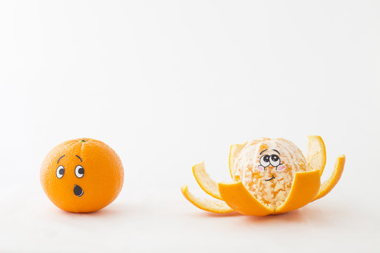 One tangerine with an astonished face and a peeled tangerine with blushing face in front of white background