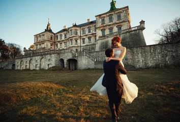 a young man lifted his wife in his arms