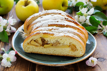 Apple pie dough with raisins in a roll.
