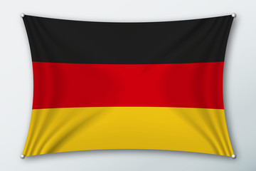 Germany national flag. Symbol of the country on a stretched fabric with waves attached with pins. Realistic vector illustration.