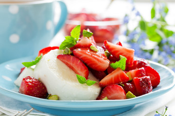 Dessert of strawberries and cheese.