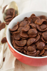 chocolate flakes in red bowl