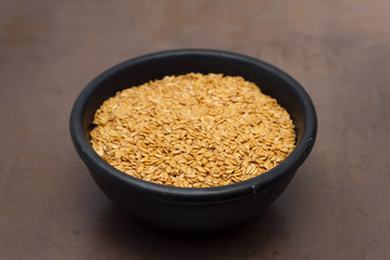 linen seeds in black bowl