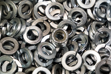 single lock nut in a box of lock washers