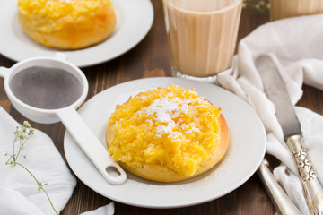 traditional portuguese bread pao de deus and coffee with milk