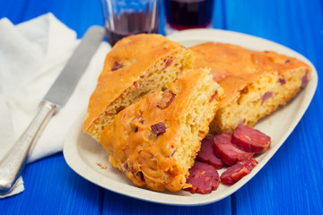 bread with  chourico on white dish