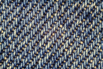 Macro image of blue jeans, denim texture background.