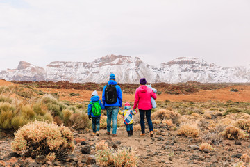 Fototapeta na wymiar family with three kids hiking in mountains