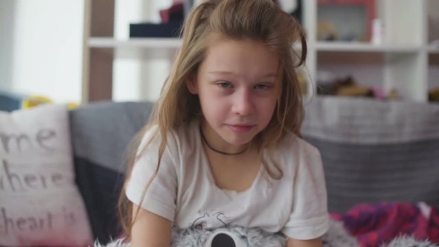 Little girl coughing at home
