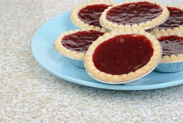 Naklejka na ściany i meble closeup strawberry tarts on a plate