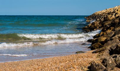 Waves rolling on the breakwater.