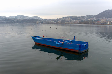 Fishing boats at the magnificent lake of Kastoria, Greece during - 136316587