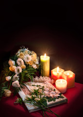 Wedding album for guests among flowers and candles