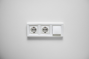 outlet and switch on the background of one color wall