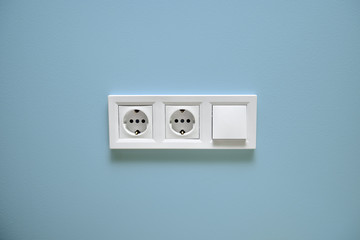 outlet and switch on the background of one color wall