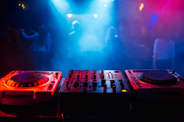 remote and mixer DJ for music in the night club
