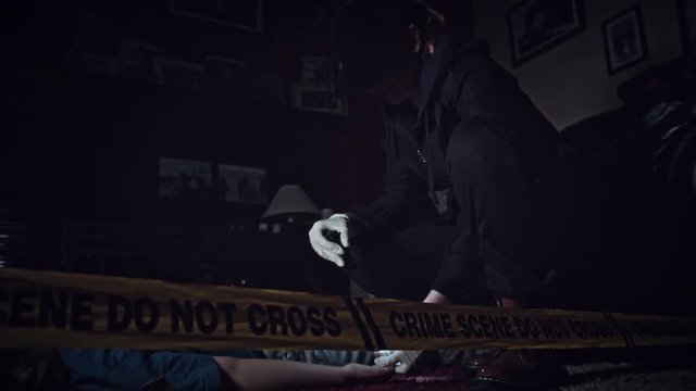 4K Crime Scene Detective Checking dead Body with Flashlight