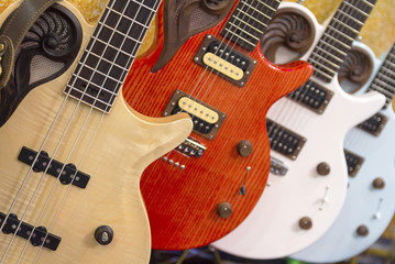 Fototapeta na wymiar Many colorful electric guitars aligned in a store showroom, body