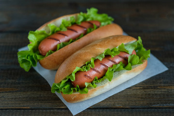 Hotdogs on a wooden board. Photo closeup.