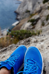 Obraz premium Man in shoes among mountain