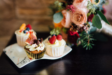 the bride's bouquet and cake, wedding attributes