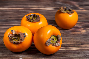 Persimmons on table