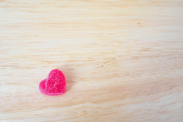 pink hearts candy on wood for valentines background