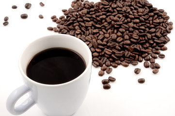 White coffee cup with coffee beans isolated on white