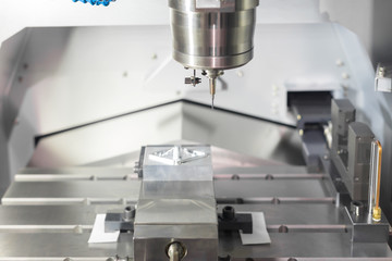 High precision CNC machining center working, operator machining