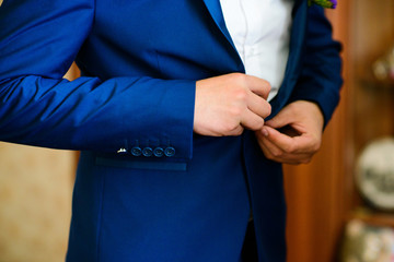 hands button open groom