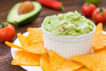 Homemade guacamole with crunchy nachos