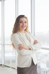 portrait of beautiful young business woman with makeup posing by
