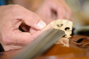 fixing a string instrument