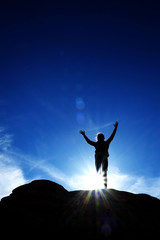 Single Person Triumphant Reaching Peak Summit on Mountain with S